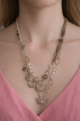 Pink Butterfly Curated Chaos Layered Charm Necklace handcrafted by artist KStonely with chains, ribbon, beads, and unique charms. One-of-a-kind mixed-media wearable art jewelry.