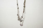 Pink Butterfly Curated Chaos Layered Charm Necklace handcrafted by artist KStonely with chains, ribbon, beads, and unique charms. One-of-a-kind mixed-media wearable art jewelry.