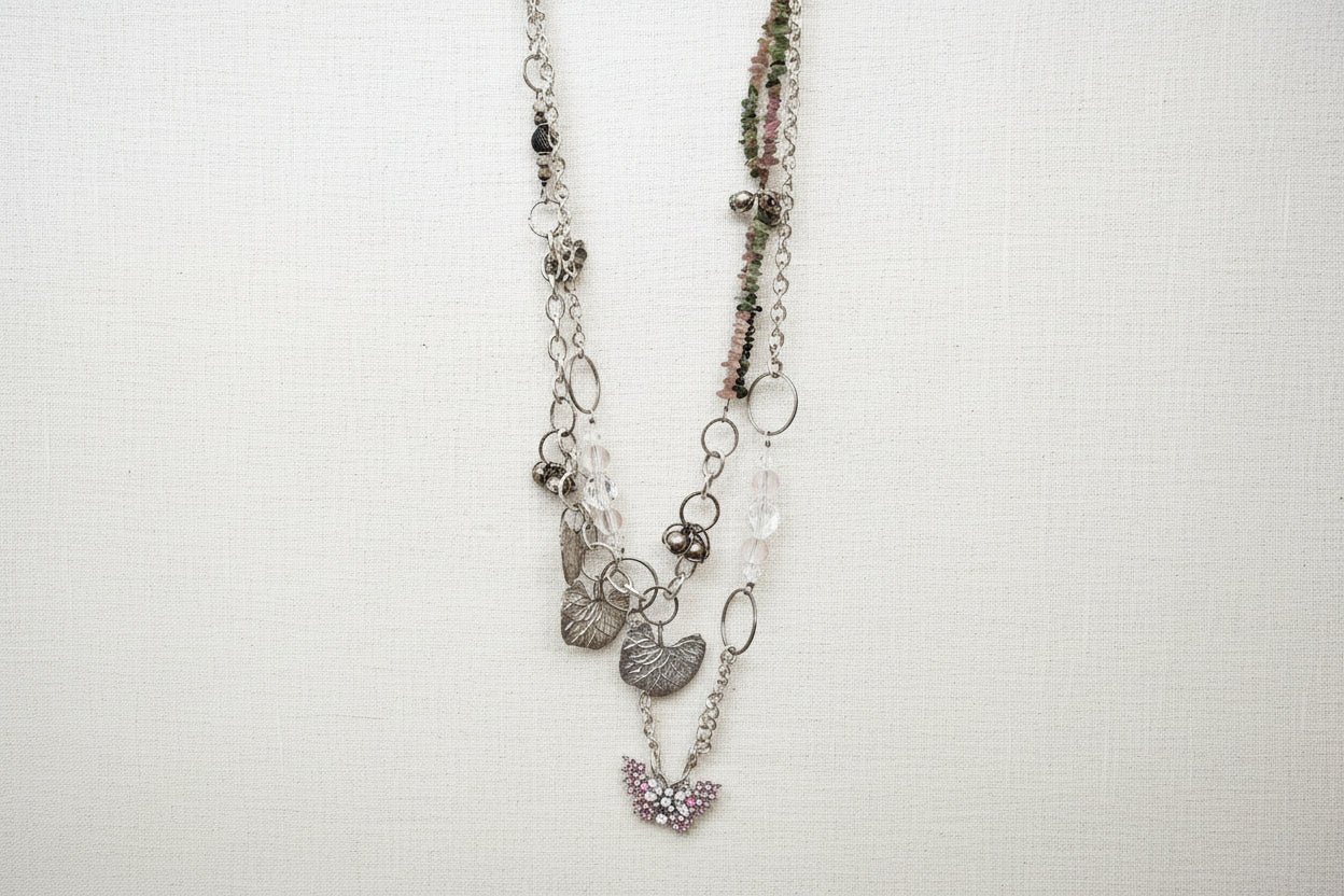 Pink Butterfly Curated Chaos Layered Charm Necklace handcrafted by artist KStonely with chains, ribbon, beads, and unique charms. One-of-a-kind mixed-media wearable art jewelry.