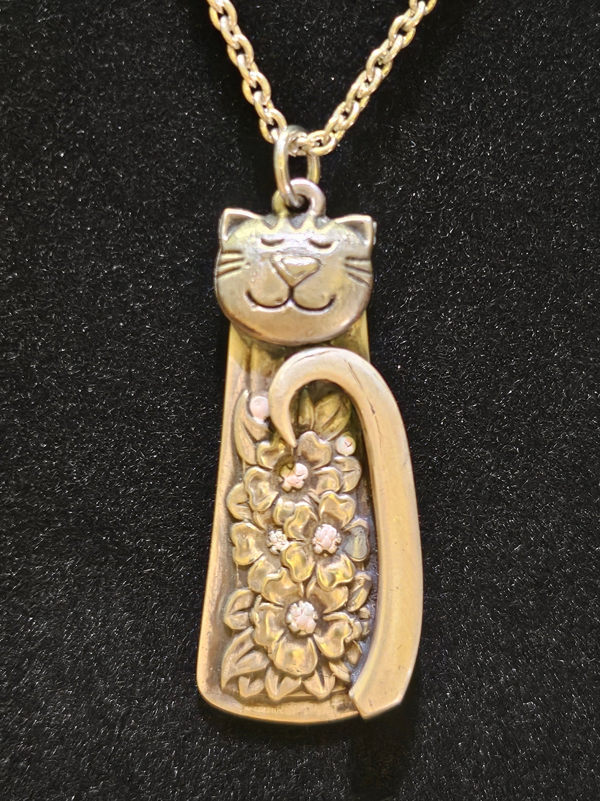 Handmade silver cat pendant necklaces from vintage silverware. Elegant, whimsical, and adjustable on a satin cord. Sustainably crafted and one-of-a-kind.