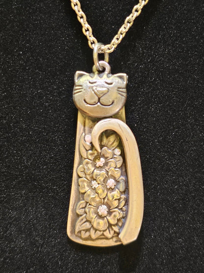 Handmade silver cat pendant necklaces from vintage silverware. Elegant, whimsical, and adjustable on a satin cord. Sustainably crafted and one-of-a-kind.