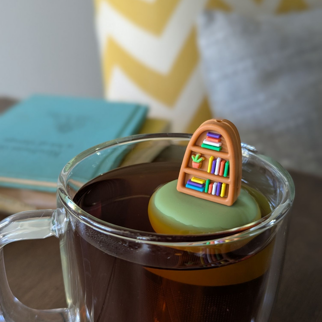 Plant Bookshelf Tea Steeper makes loose leaf tea easy in any cup. Reusable, dishwasher safe, eco-friendly. A perfect gift for tea and book lovers.