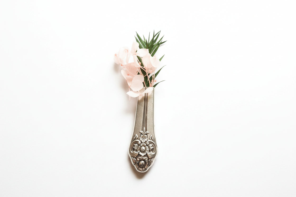 Antique silverware magnetic bud vase that sticks to fridges and metal surfaces. Holds water, one-of-a-kind vintage gift decor.