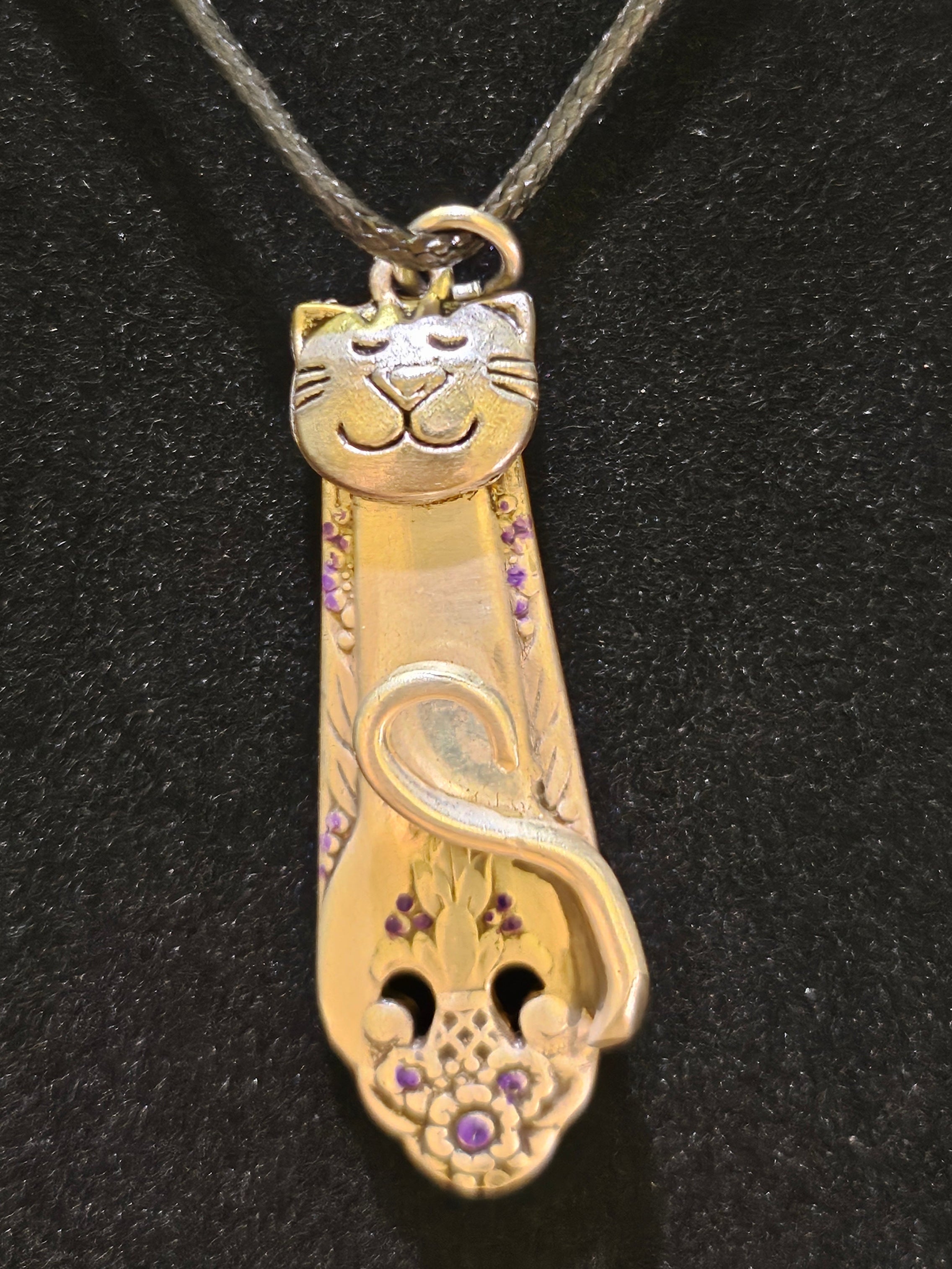 Handmade silver cat pendant necklaces from vintage silverware. Elegant, whimsical, and adjustable on a satin cord. Sustainably crafted and one-of-a-kind.