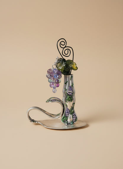 Vintage silverware bud vase with handcrafted beaded flowers by artist KStonely. Unique, eco-friendly cottagecore décor perfect for shelves, desks, and gifting.
