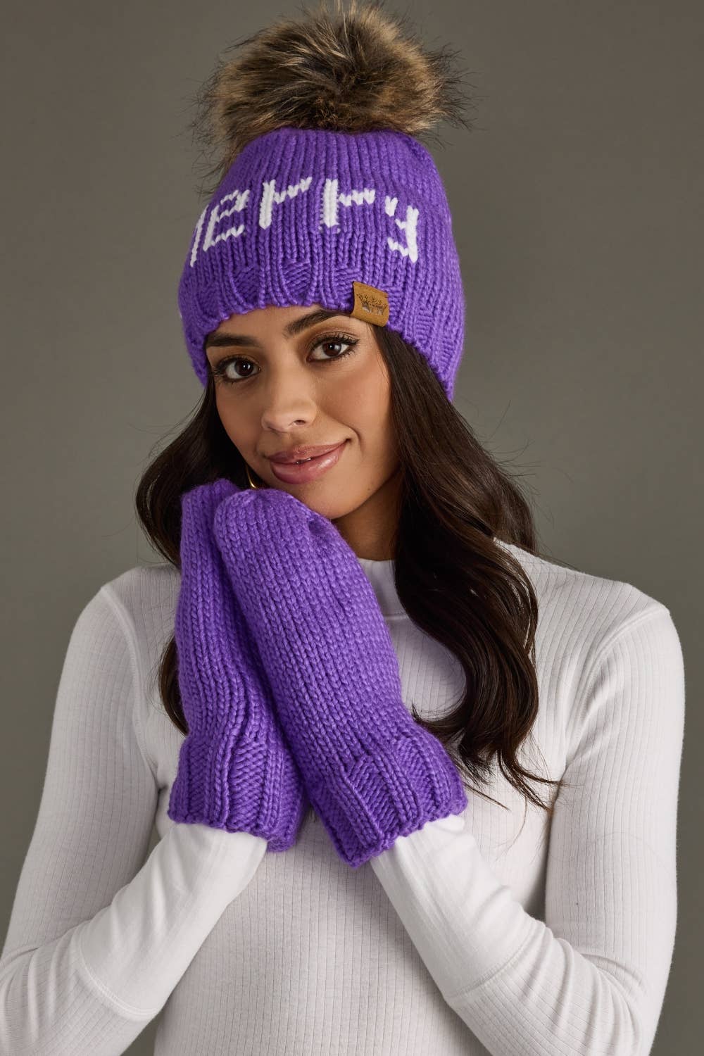 Cozy purple knit mittens with soft fleece lining for chilly days. Made from 100% acrylic and pairs with the matching hat for a colorful winter look.