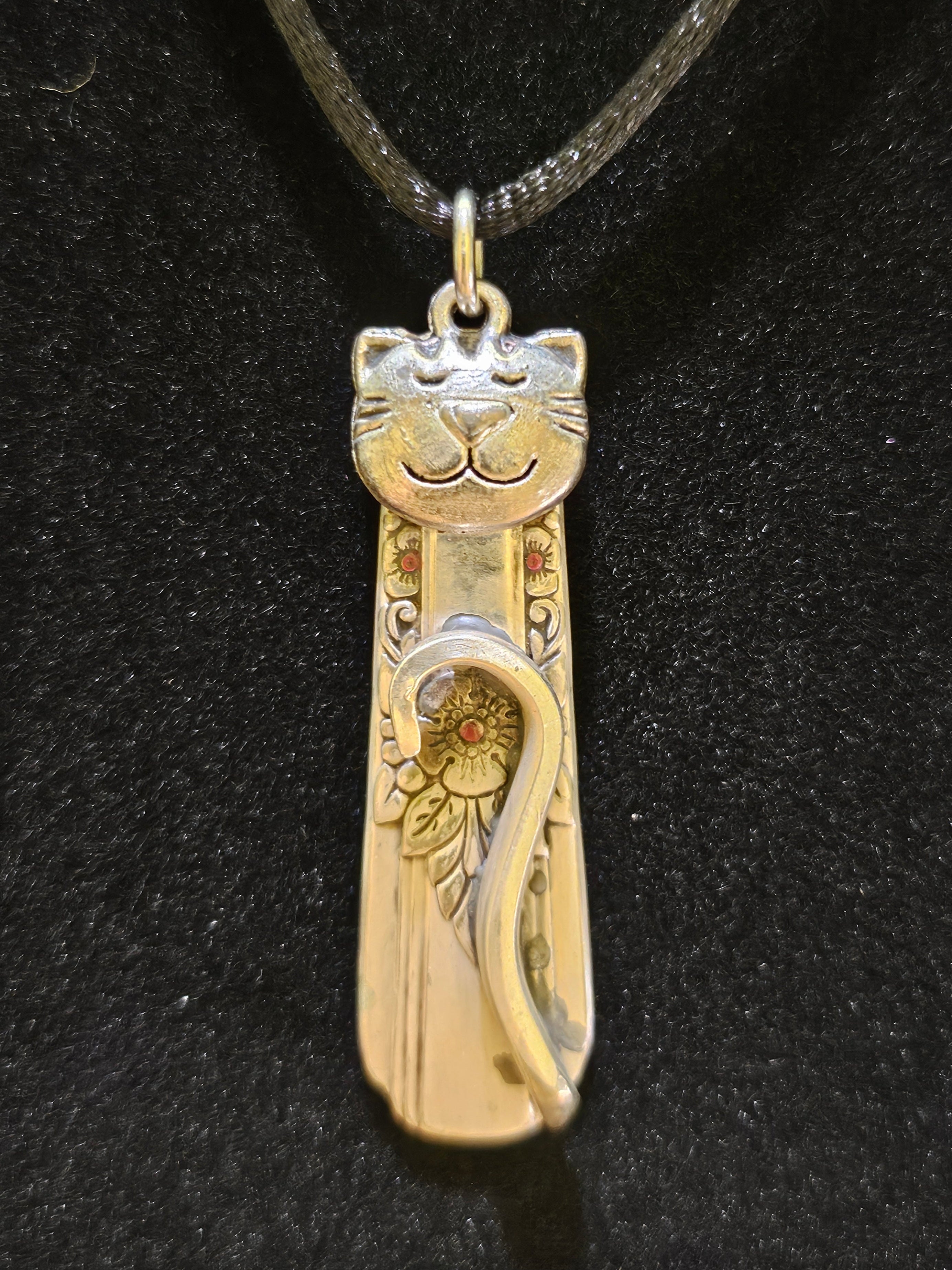 Handmade silver cat pendant necklaces from vintage silverware. Elegant, whimsical, and adjustable on a satin cord. Sustainably crafted and one-of-a-kind.