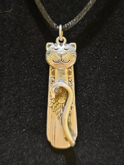 Handmade silver cat pendant necklaces from vintage silverware. Elegant, whimsical, and adjustable on a satin cord. Sustainably crafted and one-of-a-kind.