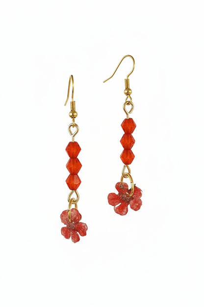 Real dried flower drop earrings preserved in resin with sparkling crystal accents. Romantic botanical jewelry with a delicate, one-of-a-kind garden feel.