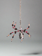 The Christmas Spider Ornament brings charm and tradition to your holiday decor. Inspired by the German legend of spiders weaving webs that Santa turned into shimmering tinsel, it symbolizes good luck and magic. Beautifully crafted, it’s a meaningful and unique addition to your tree or a thoughtful gift.