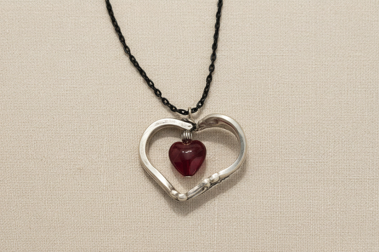 Handcrafted heart pendant made from vintage silverware. A unique, eco-friendly symbol of love—artisan-made in the USA and perfect for gifting or everyday wear.