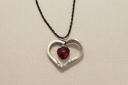 Handcrafted heart pendant made from vintage silverware. A unique, eco-friendly symbol of love—artisan-made in the USA and perfect for gifting or everyday wear.