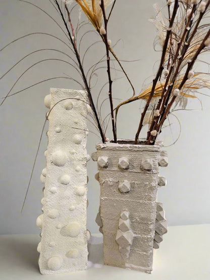 Elevate your space with this handcrafted upcycled glass Relics Cylinder Vase. Made from reclaimed materials, each piece is unique, eco-friendly, and artfully designed. Choose from Matte White, Glossy Black, or Sand finishes. Watertight and perfect for fresh or dried blooms. 