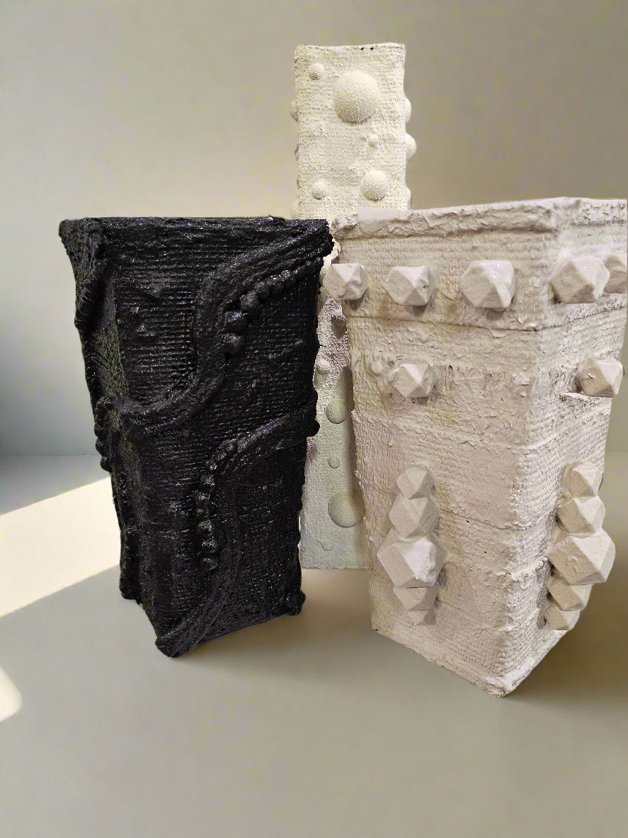 Elevate your space with this handcrafted upcycled glass Relics Cylinder Vase. Made from reclaimed materials, each piece is unique, eco-friendly, and artfully designed. Choose from Matte White, Glossy Black, or Sand finishes. Watertight and perfect for fresh or dried blooms. 