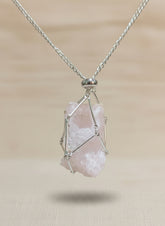 A versatile Crystal and Rock Cage Necklace with an adjustable metal pendant. Swap in your favorite gemstones or charms for a personalized, mystical accessory.