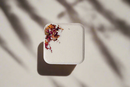 2oz handmade botanical bath bomb. Biodegradable wrap, rich oils, fizzy soak. Skin-softening, aromatic, and perfect for gifting or daily self-care rituals.