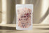 Handcrafted 5 oz botanical bath salts in heat-sealed pouches. Plant-based, aromatic blends with essential oils & florals for a calming, skin-softening soak.