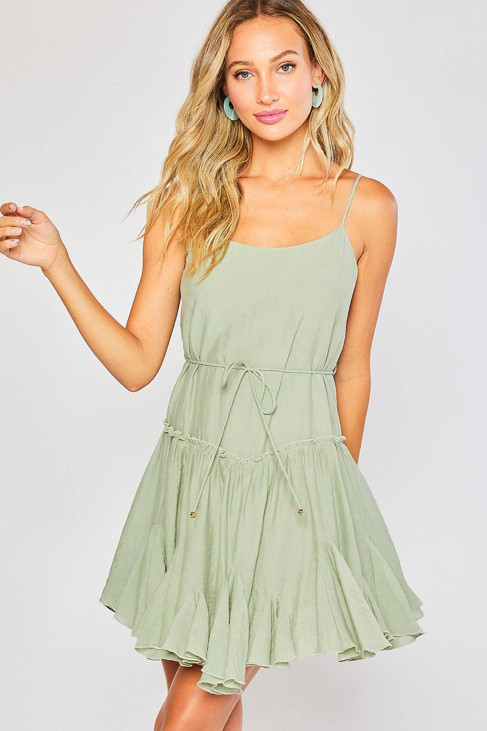 Lightweight cami swing dress with scoop neck, adjustable straps, ruffled hem &amp; tie waist. A flirty, flowy summer must-have in 3 dreamy color options.