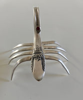 Handcrafted from vintage silverware, these salvaged scorpion and turtle sculptures bring charm, symbolism, and eco-friendly artistry to any space