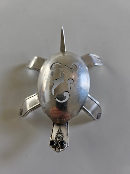 Handcrafted from vintage silverware, these salvaged scorpion and turtle sculptures bring charm, symbolism, and eco-friendly artistry to any space