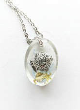 Sea Life Resin Pendant Necklaces by artist KStonely featuring shells, fish, jellyfish, and sea life miniatures in dreamy blue, brown, and gold ocean-inspired resin.