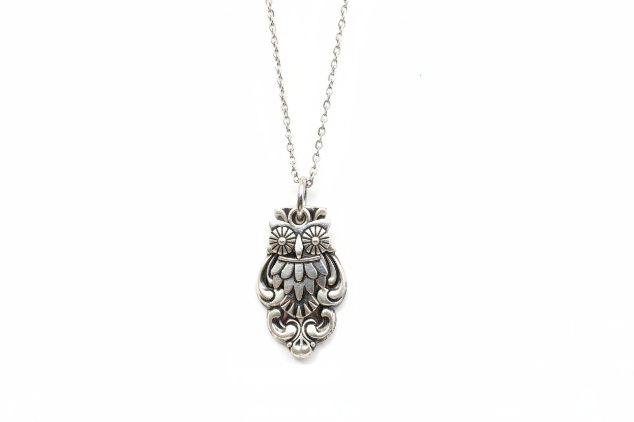 Handcrafted owl necklace made from vintage silverware. 1" pendant on 18" chain. Unique, upcycled jewelry with charm, symbolism, and timeless style.