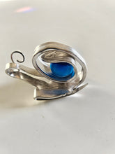 Handcrafted from vintage silverware, these whimsical snails feature shimmering glass orb shells—each a one-of-a-kind symbol of patience and charm.