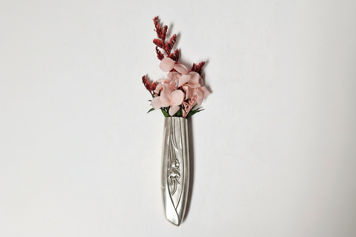 Antique silverware magnetic bud vase that sticks to fridges and metal surfaces. Holds water, one-of-a-kind vintage gift decor.