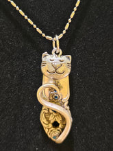 Handmade silver cat pendant necklaces from vintage silverware. Elegant, whimsical, and adjustable on a satin cord. Sustainably crafted and one-of-a-kind.