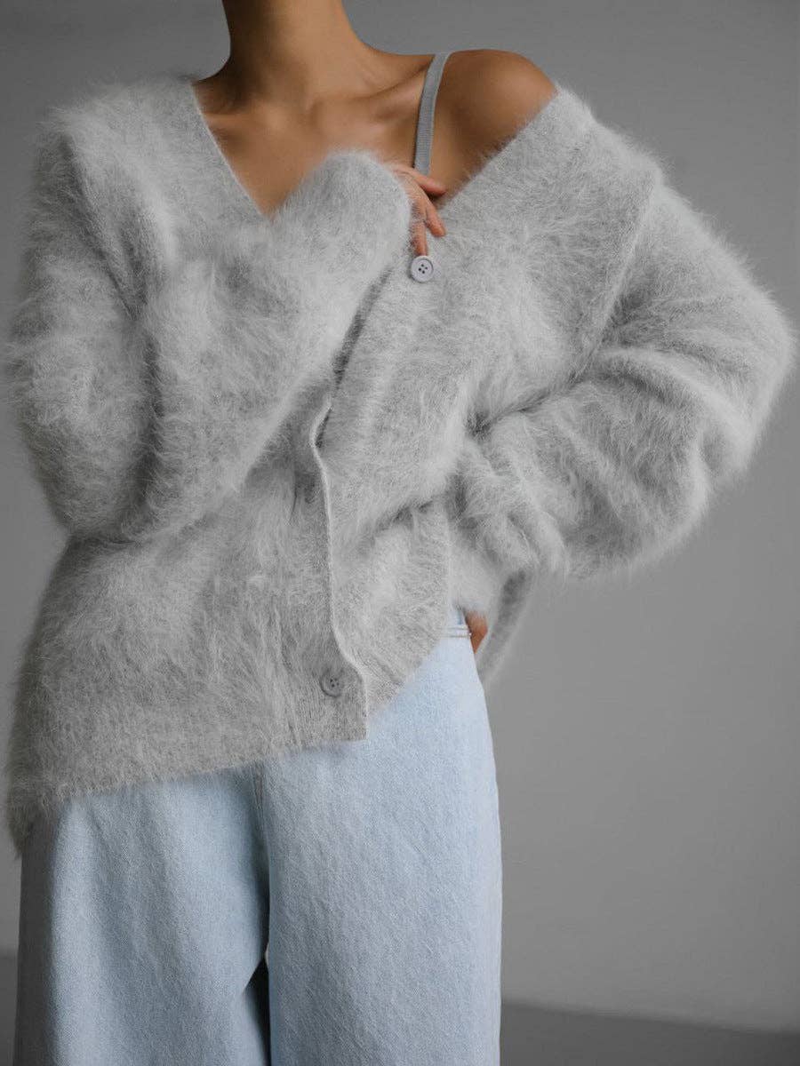 Luxuriously soft fluffy V-neck button-down cardigan with relaxed fit and cozy texture. Wear on or off shoulder—perfect for chic fall and winter layering.
