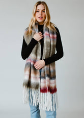 Striped fringe scarf in olive, beige, pink, and maroon. Soft acrylic blend, 12" x 72", cozy, stylish, and versatile for layering in any season.