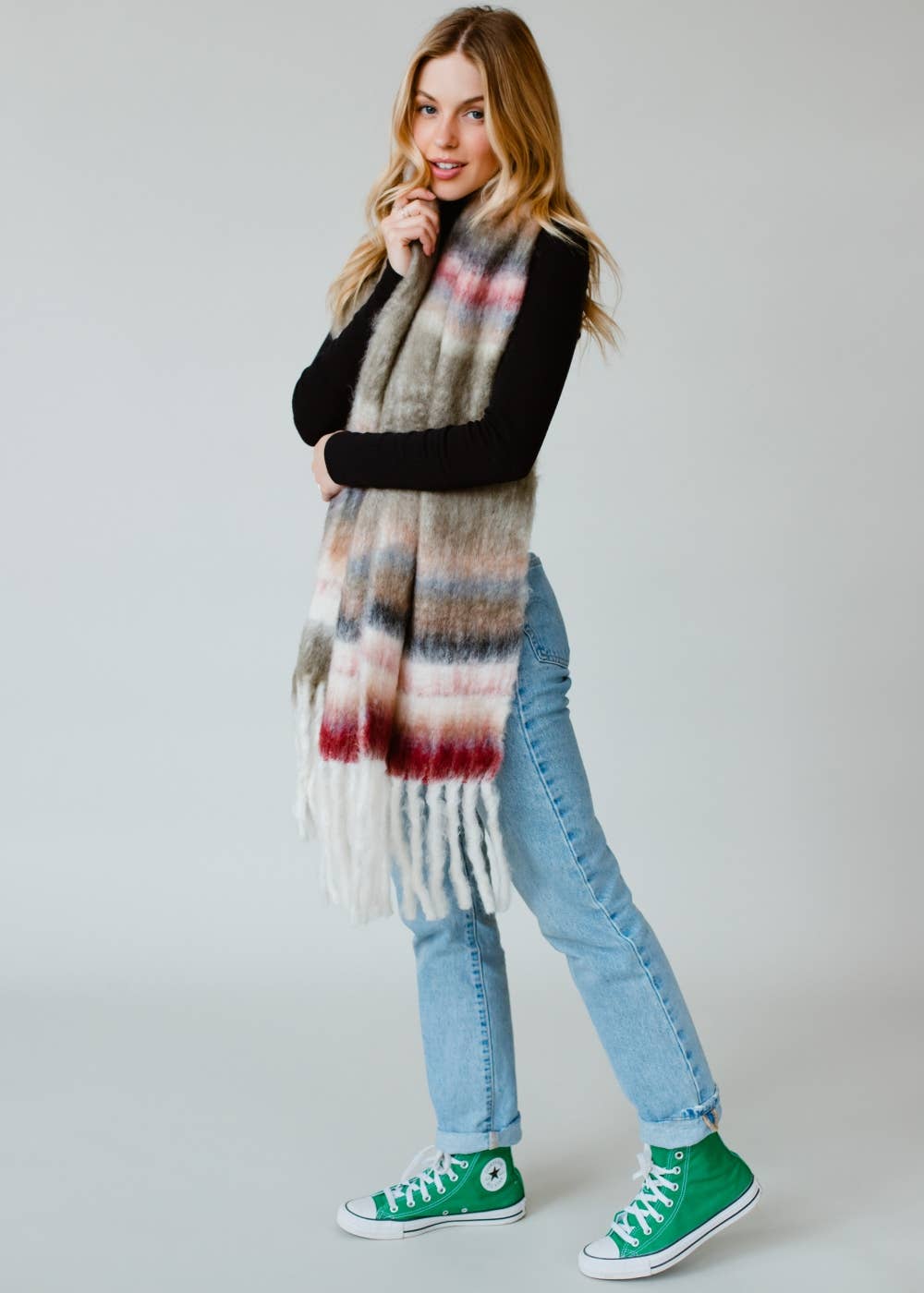 Striped fringe scarf in olive, beige, pink, and maroon. Soft acrylic blend, 12" x 72", cozy, stylish, and versatile for layering in any season.