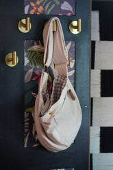 Pet Crossbody Sling and Carrier keeps you hands free while your pet stays secure. Adjustable strap, cozy design and safety clip for everyday adventures.