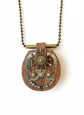 Wildcrafted Wood Art Pendants handcrafted by artist KStonely with natural wood, beads, gears, and mixed-media elements. Unique, one-of-a-kind wearable art necklaces.