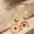 Sun & Moon Daisy Drop Floral Earrings with daisy pendants. Lightweight, hypoallergenic, nickel- and lead-free—perfect for celestial style lovers.
