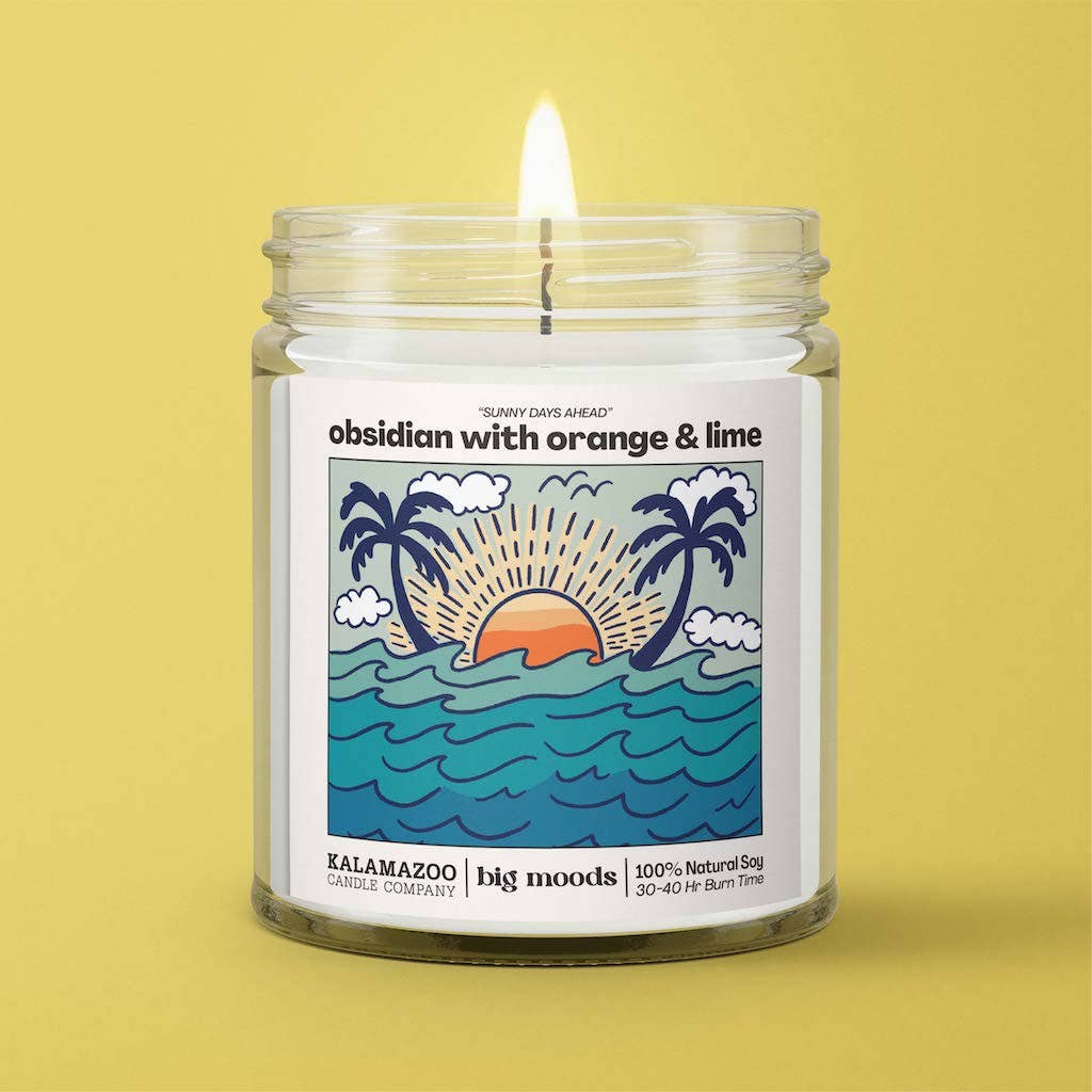 Sunny Days Ahead: A bright blend of orange, lime & obsidian in a 5oz soy candle. Vegan, eco-friendly, and hand-poured for 30–40 hours of sunny coastal bliss.