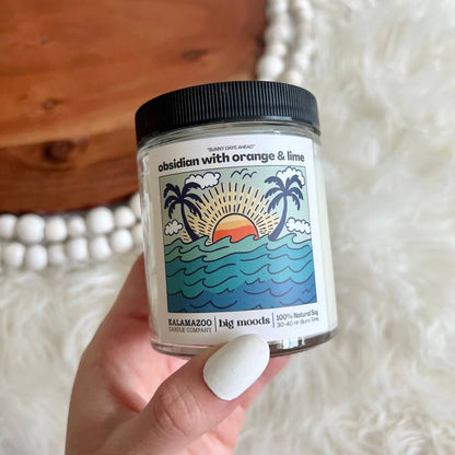 Sunny Days Ahead: A bright blend of orange, lime &amp; obsidian in a 5oz soy candle. Vegan, eco-friendly, and hand-poured for 30–40 hours of sunny coastal bliss.