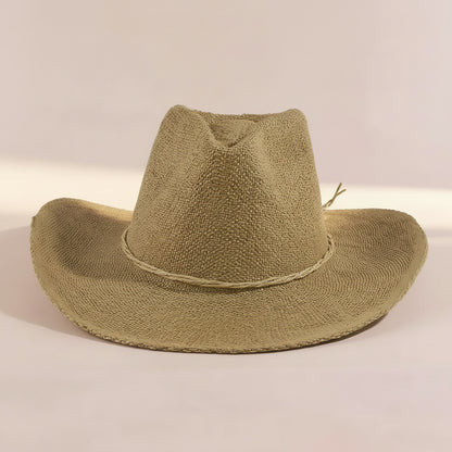 Braided cord band cowboy hat featuring woven paper straw texture and soft curved brim. Lightweight boho western style perfect for beach days, festivals, and summer outfits.