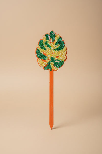 Bedazzled Monstera wooden plant stakes, hand-painted with sparkling details. Choose Monstera, Albo, Aurea or Thai Constellation for unique plant décor.