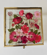 Floral mirrored keepsake and jewelry box with real pressed flowers. A 5" botanical glass box by artist Angel Singh, blending elegant storage with preserved floral art.