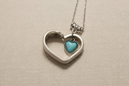Handcrafted heart pendant made from vintage silverware. A unique, eco-friendly symbol of love—artisan-made in the USA and perfect for gifting or everyday wear.