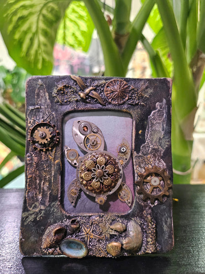 Add industrial charm to your space with Steampunk Frames &amp; Gear Art. Featuring intricate gear designs in bold frames, these unique pieces bring vintage steampunk style to walls or shelves. Perfect for home or office decor, they’re versatile, eye-catching, and a standout addition to any aesthetic.