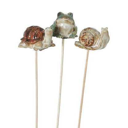 Whimsical ceramic animal plant stakes add charm to any pot or garden. Three cute designs, each 3" wide on a 9" wooden stake. Perfect for gifting—plants not included.