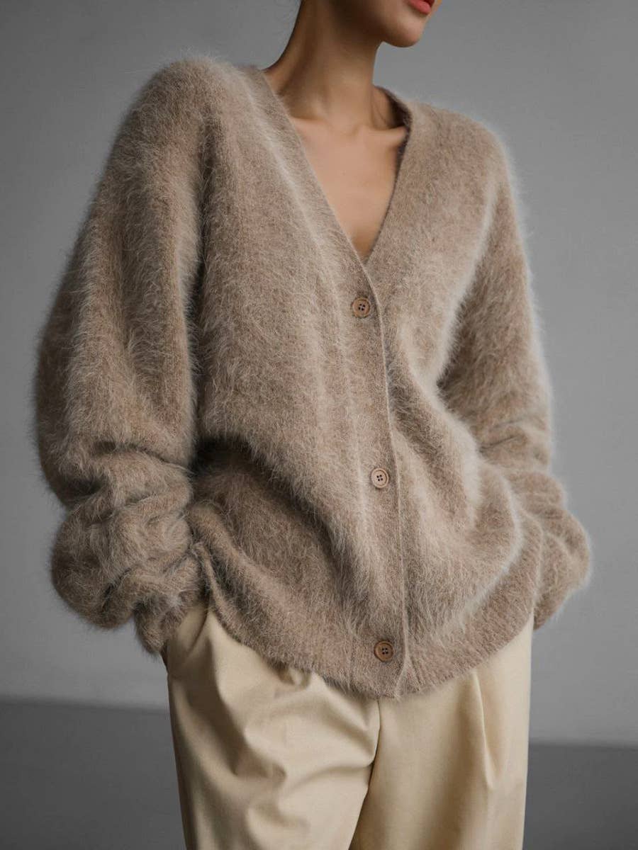 Luxuriously soft fluffy V-neck button-down cardigan with relaxed fit and cozy texture. Wear on or off shoulder—perfect for chic fall and winter layering.
