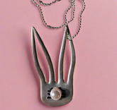 The Salvaged Silver Bunny Pendant is a handcrafted, one-of-a-kind piece made from recycled vintage silverware. Designed by artisan KStonely, it blends whimsical Easter charm with sustainable craftsmanship. Lightweight and unique, it’s perfect for everyday wear or special occasions. A timeless, upcycled treasure that celebrates history and artistry. 