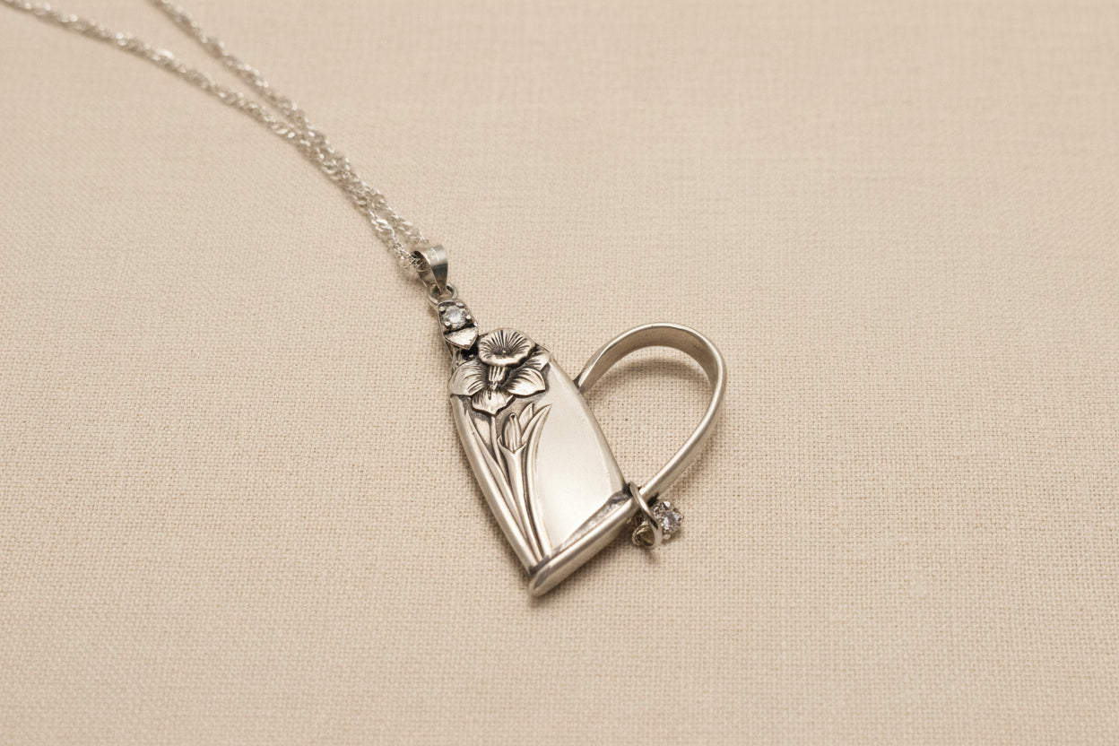 Handcrafted heart pendant made from vintage silverware. A unique, eco-friendly symbol of love—artisan-made in the USA and perfect for gifting or everyday wear.