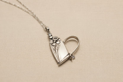 Handcrafted heart pendant made from vintage silverware. A unique, eco-friendly symbol of love—artisan-made in the USA and perfect for gifting or everyday wear.