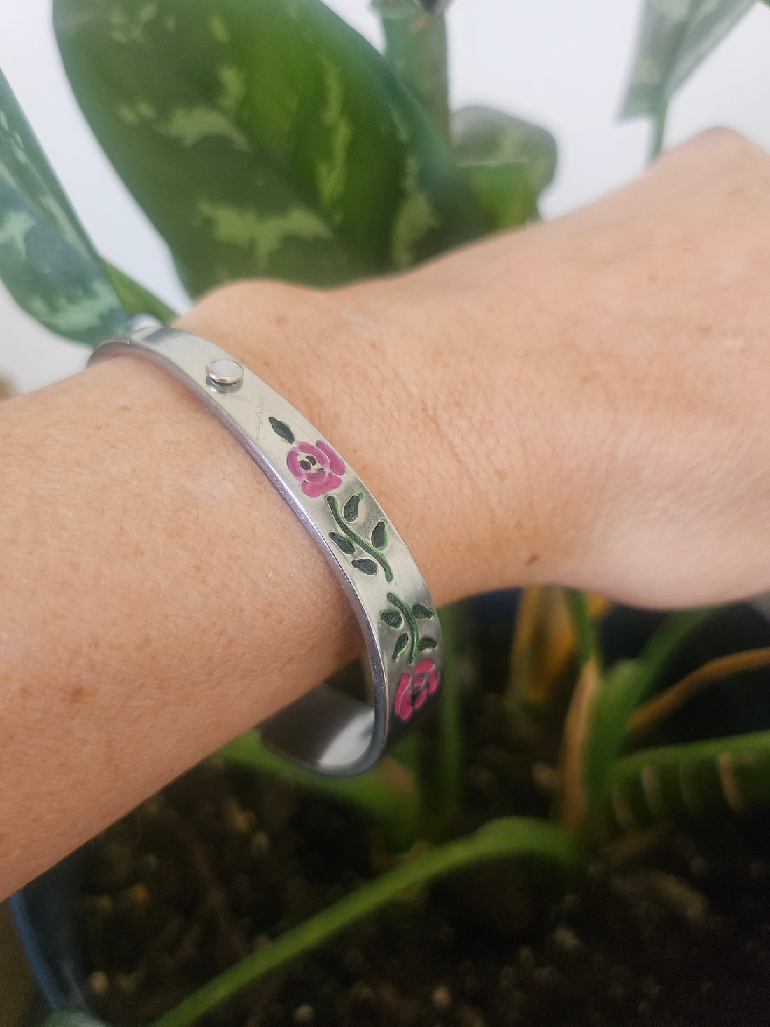 Handcrafted 6" floral cuff bracelet made from vintage silverware with a jewel accent. A one-of-a-kind piece blending antique charm and timeless elegance.