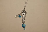 Vintage Sweetheart collectible silverware pattern transformed into a handcrafted birdhouse necklace. Sustainable cottagecore heirloom jewelry.