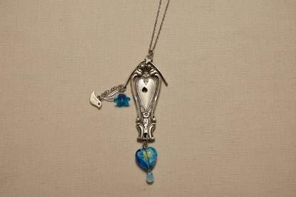 Vintage Sweetheart collectible silverware pattern transformed into a handcrafted birdhouse necklace. Sustainable cottagecore heirloom jewelry.